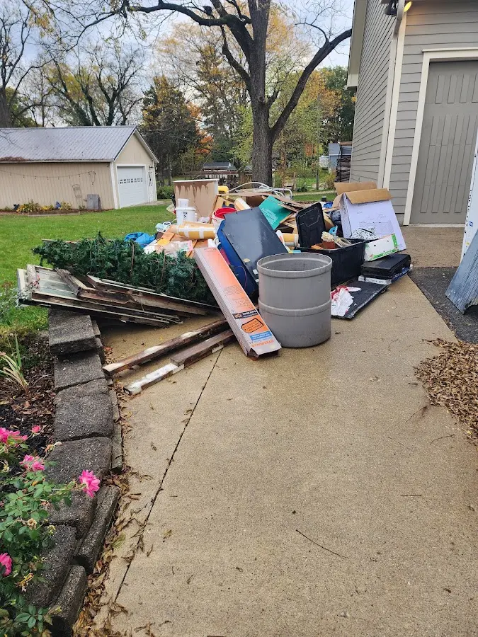 Dumpster being loaded with debris for Residential Dumpster Rental in Surfside Beach